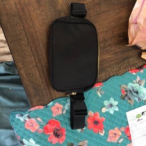 Black and gold fanny pack